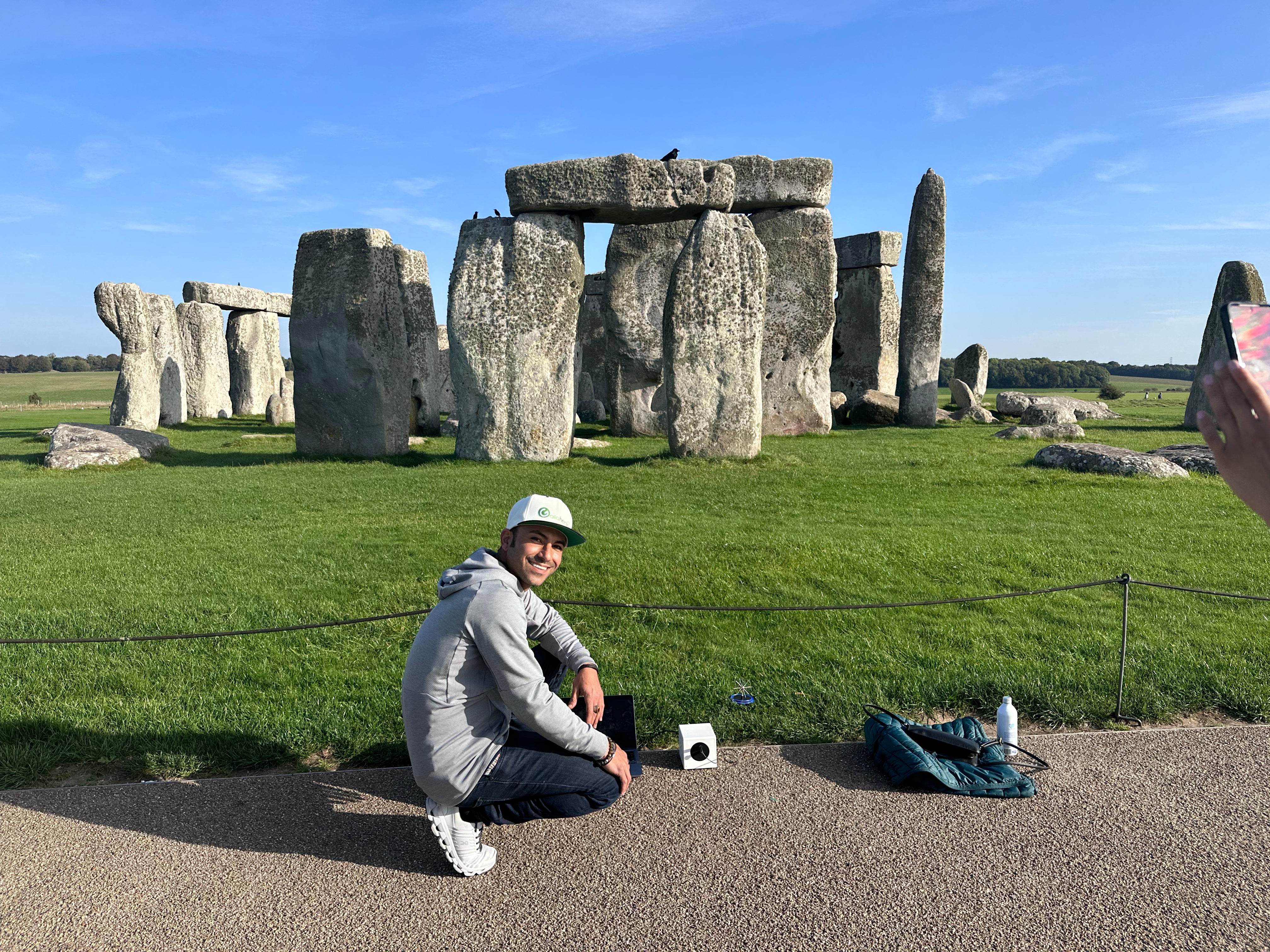 Nima Farshid, certified Bio-Well practitioner, using a Bio-Well device to measure the energy of Stonehenge during a research trip